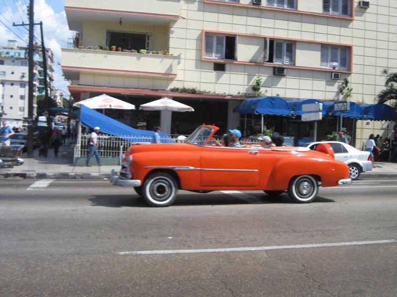 orange vintage car in havana